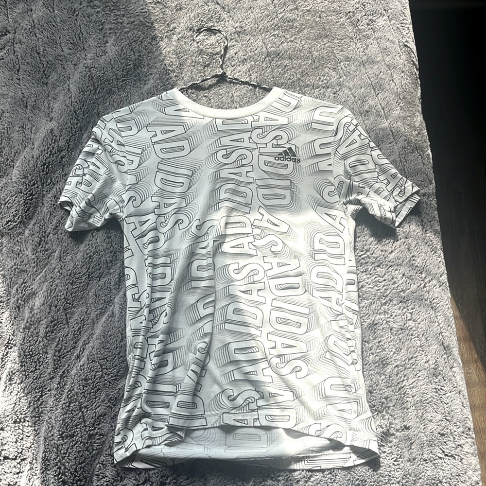 White adidas t-shirt with black logos.